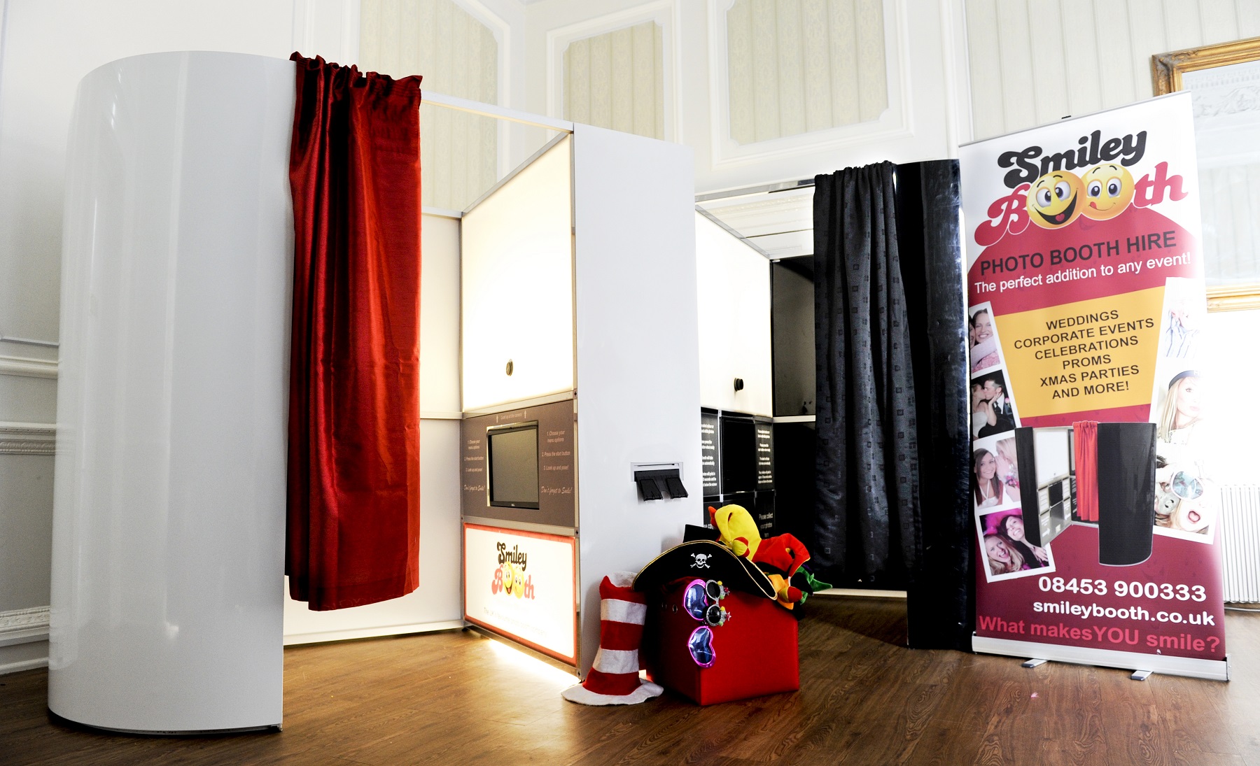 image showing white and black photo booth set up smiley booth franchise enquipment